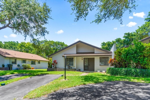 3693 N Arelia Dr N, Delray Beach, FL 33445 - single story home with a front yard