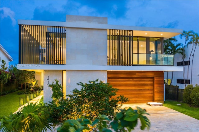 1410 S Biscayne Point Rd, Miami Beach, FL 33141 - view of front of home with a balcony, an attached garage, and concrete driveway