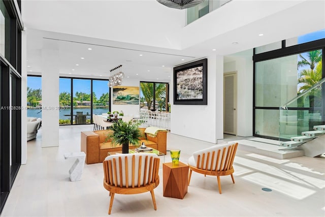 1410 S Biscayne Point Rd, Miami Beach, FL 33141 - building lobby with expansive windows, a water view, recessed lighting, and a towering ceiling