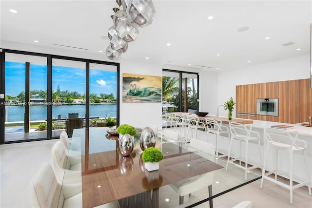 1410 S Biscayne Point Rd, Miami Beach, FL 33141 - dining space featuring a water view and recessed lighting