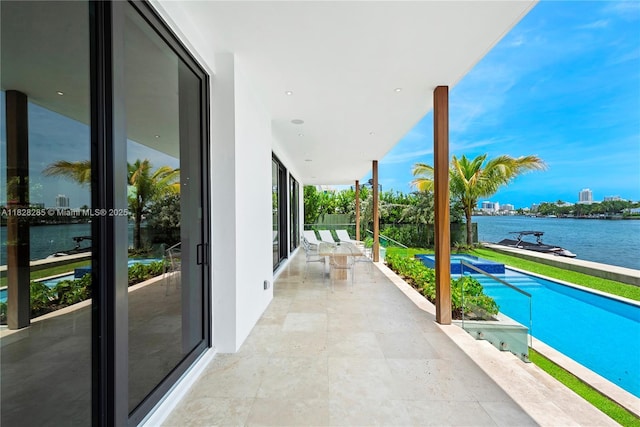 1410 S Biscayne Point Rd, Miami Beach, FL 33141 - balcony with a water view and view of pool area