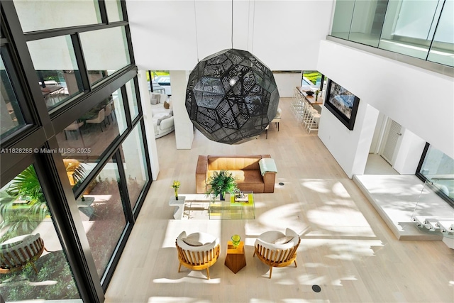 1410 S Biscayne Point Rd, Miami Beach, FL 33141 - living area featuring wood finished floors and a fireplace