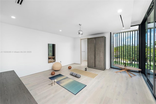 1410 S Biscayne Point Rd, Miami Beach, FL 33141 - workout room with light wood-type flooring and recessed lighting