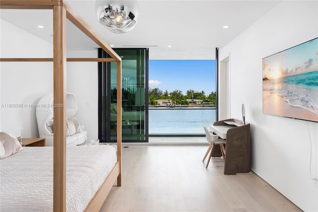 1410 S Biscayne Point Rd, Miami Beach, FL 33141 - bedroom featuring wood finished floors, recessed lighting, and a wall of windows