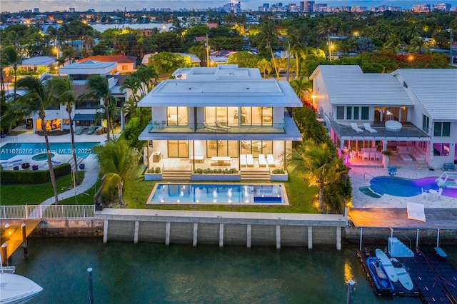 1410 S Biscayne Point Rd, Miami Beach, FL 33141 - rear view of property featuring a balcony, a water view, a city view, and a patio