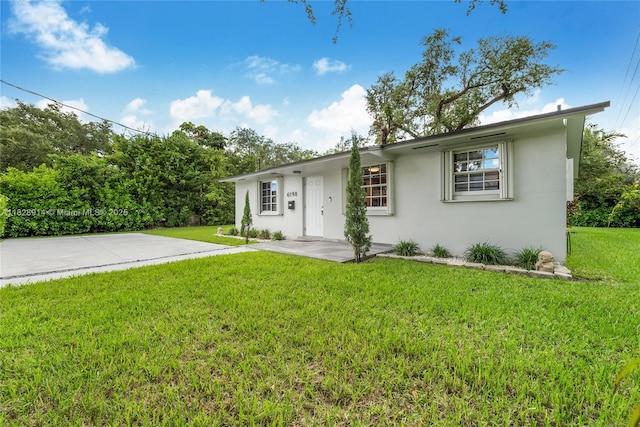 6198 SW 63rd St, South Miami, FL 33143 - ranch-style house featuring stucco siding and a front lawn