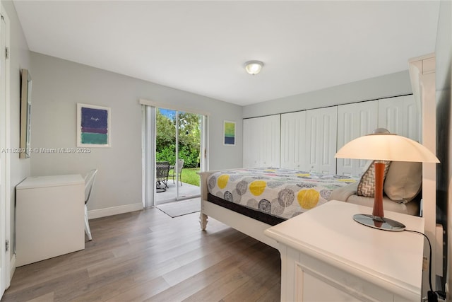 6198 SW 63rd St, South Miami, FL 33143 - bedroom featuring access to outside and light wood-type flooring
