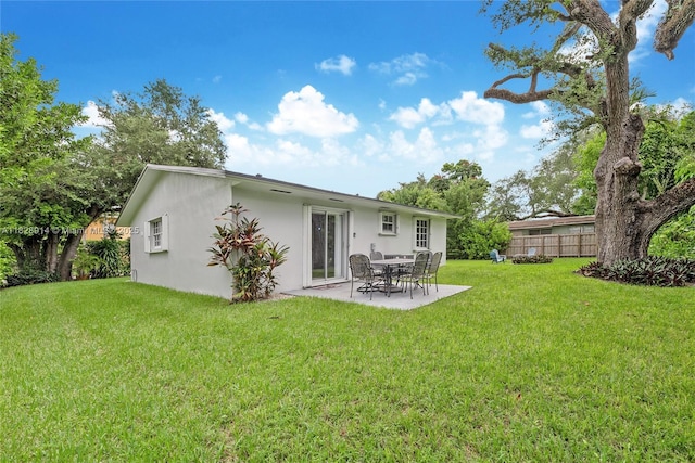 6198 SW 63rd St, South Miami, FL 33143 - rear view of property featuring stucco siding and a patio area