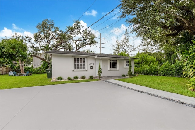 6198 SW 63rd St, South Miami, FL 33143 - single story home featuring stucco siding, a front yard, and concrete driveway