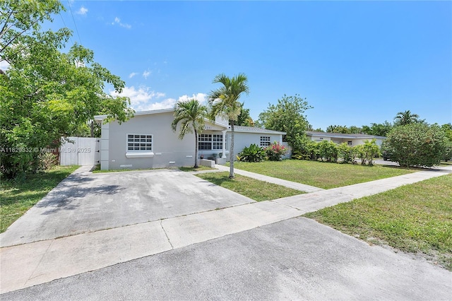 3301 NW 42nd St, Lauderdale Lakes, FL 33309 - ranch-style home featuring a front lawn, stucco siding, and a gate