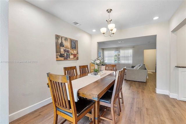 3301 NW 42nd St, Lauderdale Lakes, FL 33309 - dining room with light wood finished floors, a chandelier, and recessed lighting