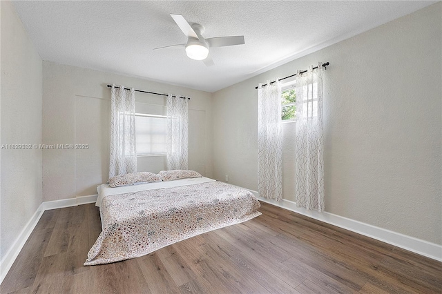 3301 NW 42nd St, Lauderdale Lakes, FL 33309 - bedroom featuring wood finished floors, ceiling fan, and a textured ceiling