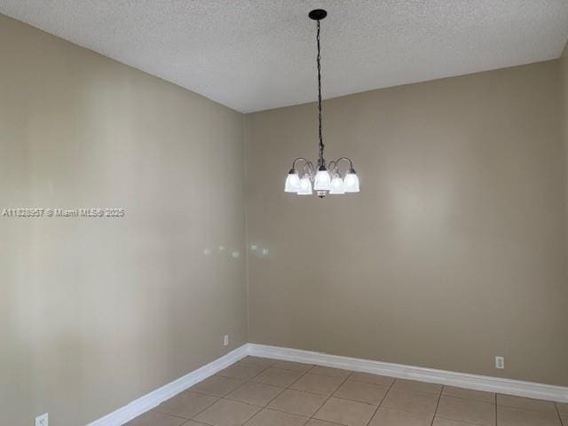 3736 SW 50th St, Hollywood, FL 33312 - empty room with a textured ceiling, a chandelier, and light tile patterned floors