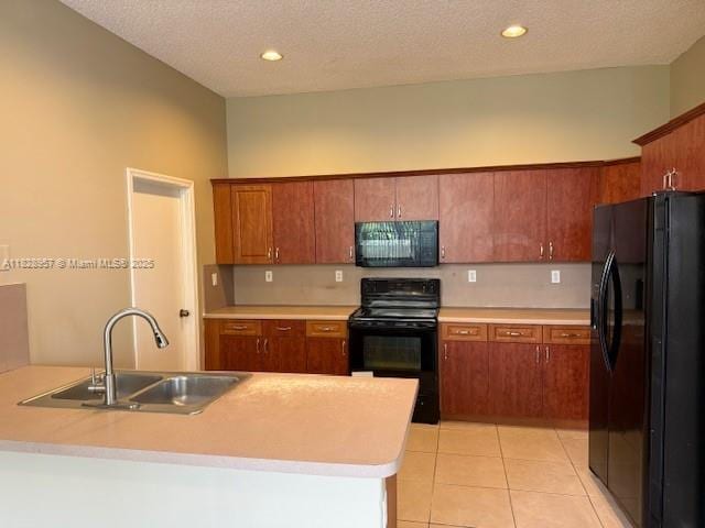 3736 SW 50th St, Hollywood, FL 33312 - kitchen featuring black appliances, light countertops, brown cabinets, light tile patterned flooring, and a peninsula