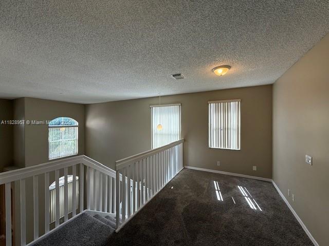 3736 SW 50th St, Hollywood, FL 33312 - unfurnished room with healthy amount of natural light, carpet, and a textured ceiling