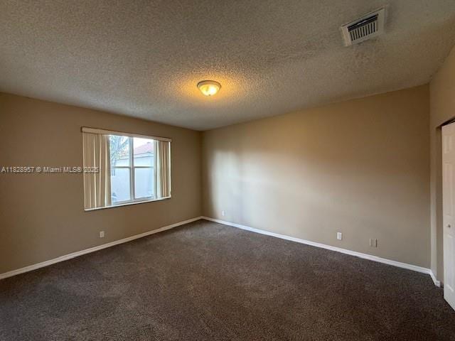 3736 SW 50th St, Hollywood, FL 33312 - empty room with dark colored carpet and a textured ceiling