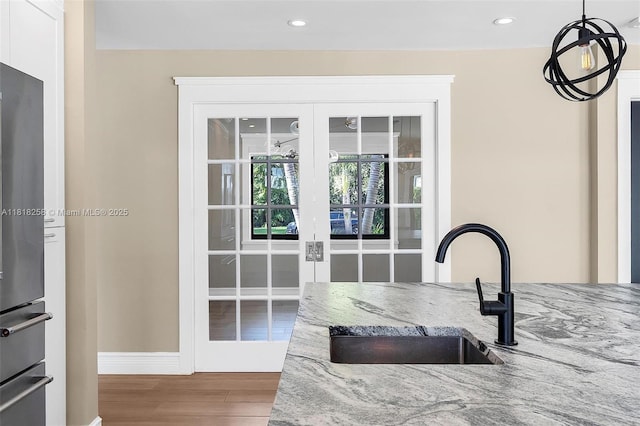 9745 SW 126th Ter, Miami, FL 33176 - dining space with french doors, wood finished floors, and recessed lighting