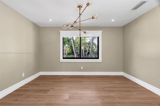 9745 SW 126th Ter, Miami, FL 33176 - unfurnished room with a chandelier, light wood-type flooring, and recessed lighting