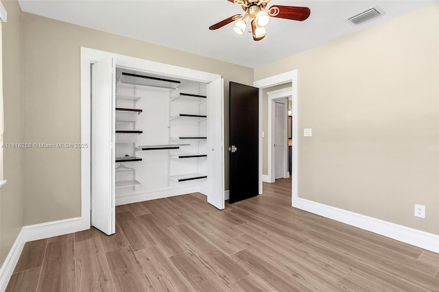 9745 SW 126th Ter, Miami, FL 33176 - unfurnished bedroom with light wood finished floors, a closet, and a ceiling fan
