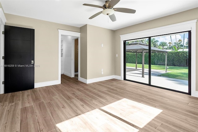 9745 SW 126th Ter, Miami, FL 33176 - empty room with light wood-style floors and a ceiling fan