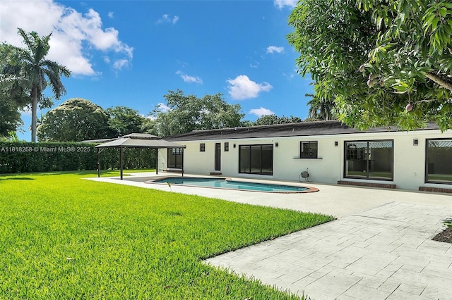 9745 SW 126th Ter, Miami, FL 33176 - rear view of house featuring a patio area, a gazebo, a yard, and stucco siding