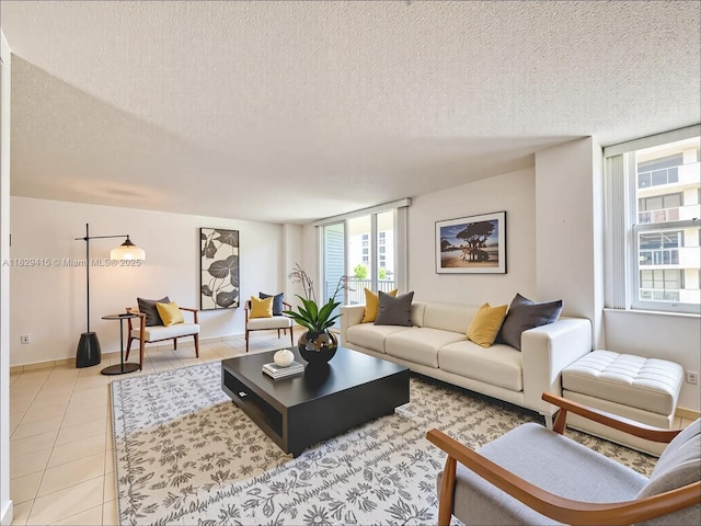 5701 Collins Ave Unit 417, Miami Beach, FL 33140 - living area featuring a textured ceiling and light tile patterned floors