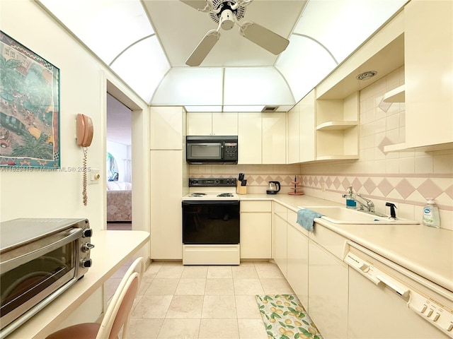 5701 Collins Ave Unit 417, Miami Beach, FL 33140 - kitchen with white appliances, a ceiling fan, backsplash, and light countertops