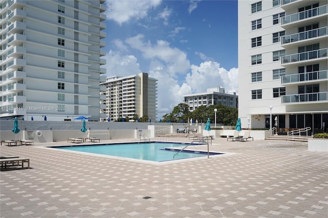 5701 Collins Ave Unit 417, Miami Beach, FL 33140 - community pool featuring a patio area