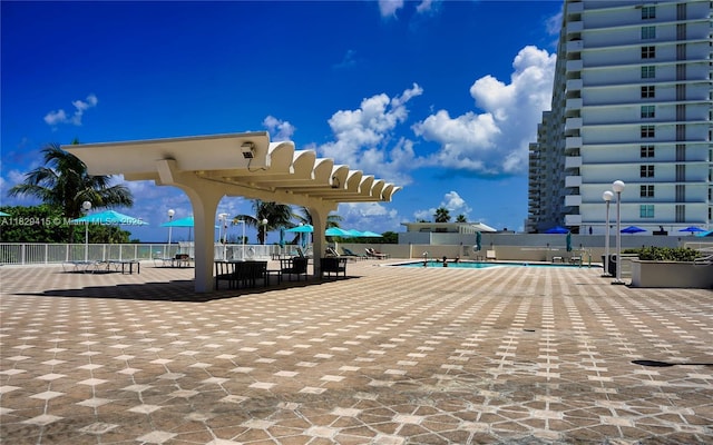 5701 Collins Ave Unit 417, Miami Beach, FL 33140 - community pool with a pergola and a patio area