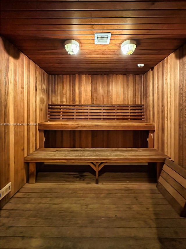 5701 Collins Ave Unit 417, Miami Beach, FL 33140 - relaxing sauna with wooden walls, wooden ceiling, and hardwood / wood-style flooring