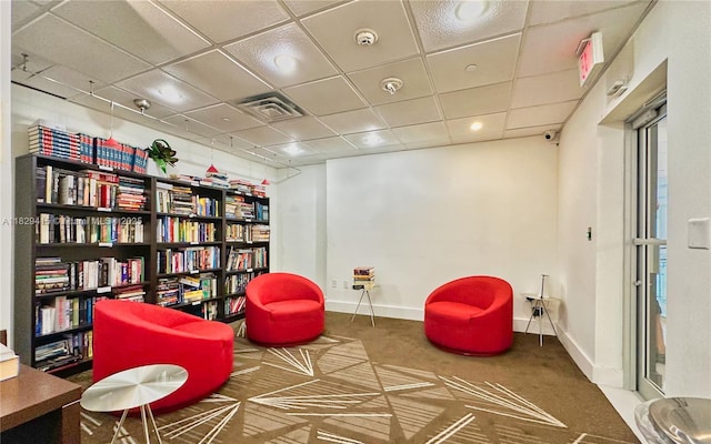 5701 Collins Ave Unit 417, Miami Beach, FL 33140 - sitting room featuring carpet, a paneled ceiling, and recessed lighting