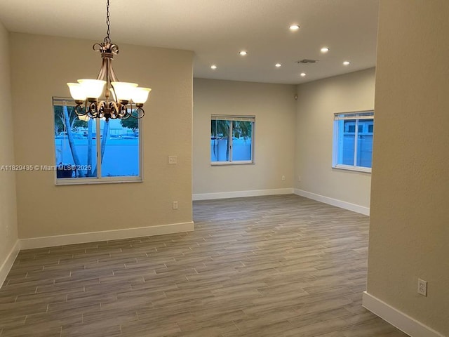 5521 SW 158th Ct, Miami, FL 33185 - empty room with recessed lighting, wood finished floors, and a chandelier