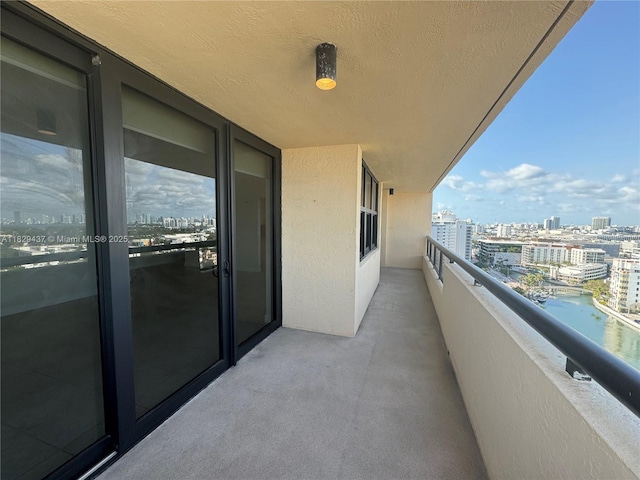 2555 Collins Ave Unit 2002, Miami Beach, FL 33140 - balcony featuring a view of city and a water view