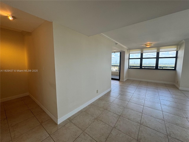 2555 Collins Ave Unit 2002, Miami Beach, FL 33140 - spare room featuring light tile patterned floors and ornamental molding