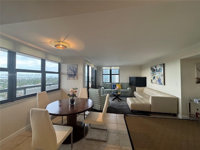 2555 Collins Ave Unit 2002, Miami Beach, FL 33140 - dining area featuring crown molding and light tile patterned flooring