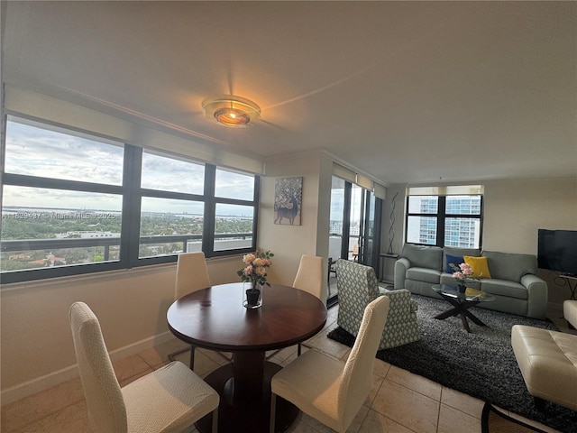 2555 Collins Ave Unit 2002, Miami Beach, FL 33140 - dining room featuring light tile patterned flooring and baseboards