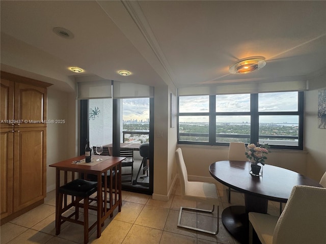 2555 Collins Ave Unit 2002, Miami Beach, FL 33140 - dining area featuring light tile patterned flooring and plenty of natural light