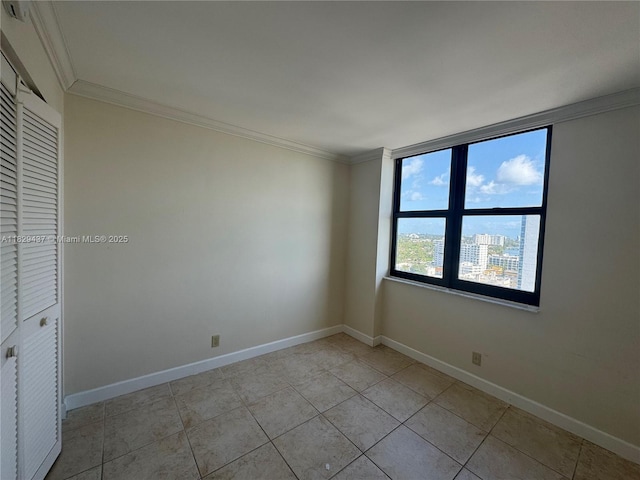 2555 Collins Ave Unit 2002, Miami Beach, FL 33140 - unfurnished room with ornamental molding and light tile patterned floors