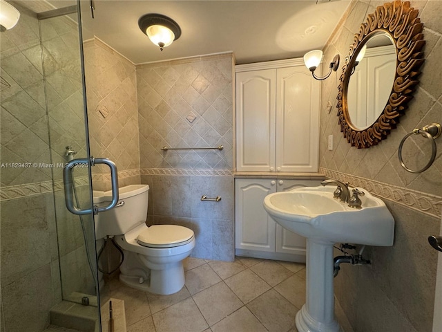 2555 Collins Ave Unit 2002, Miami Beach, FL 33140 - bathroom featuring tile walls, tile patterned floors, and a stall shower