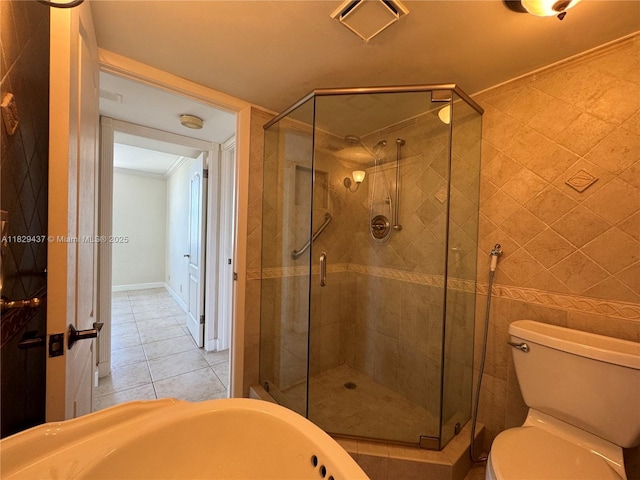 2555 Collins Ave Unit 2002, Miami Beach, FL 33140 - bathroom with tile patterned floors, a shower stall, a bathtub, and crown molding