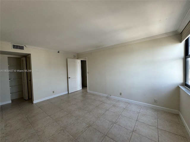 2555 Collins Ave Unit 2002, Miami Beach, FL 33140 - unfurnished bedroom with ornamental molding and light tile patterned floors