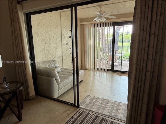 126 Centennial Ct, Deerfield Beach, FL 33442 - doorway to outside with ceiling fan and light tile patterned flooring