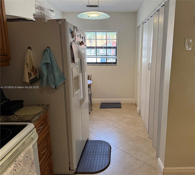 126 Centennial Ct, Deerfield Beach, FL 33442 - bathroom featuring tile patterned flooring and a textured ceiling