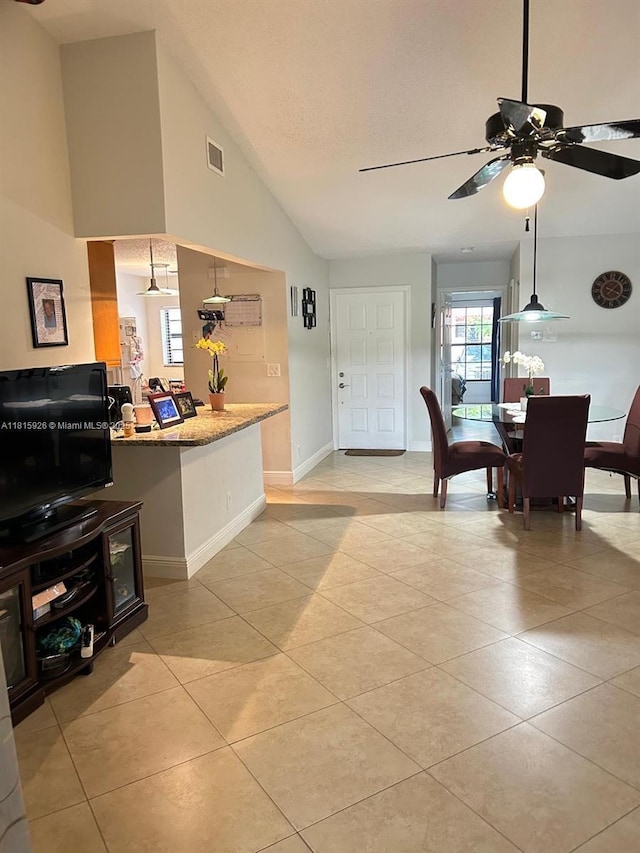 126 Centennial Ct, Deerfield Beach, FL 33442 - kitchen with light tile patterned floors, vaulted ceiling, and ceiling fan