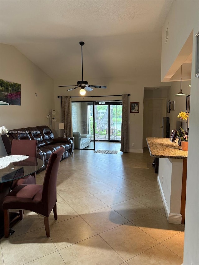 126 Centennial Ct, Deerfield Beach, FL 33442 - dining room with vaulted ceiling, a ceiling fan, and light tile patterned floors
