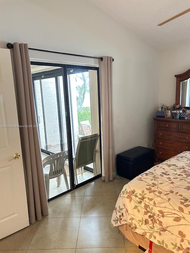 126 Centennial Ct, Deerfield Beach, FL 33442 - bedroom with lofted ceiling, access to outside, light tile patterned flooring, and a textured ceiling
