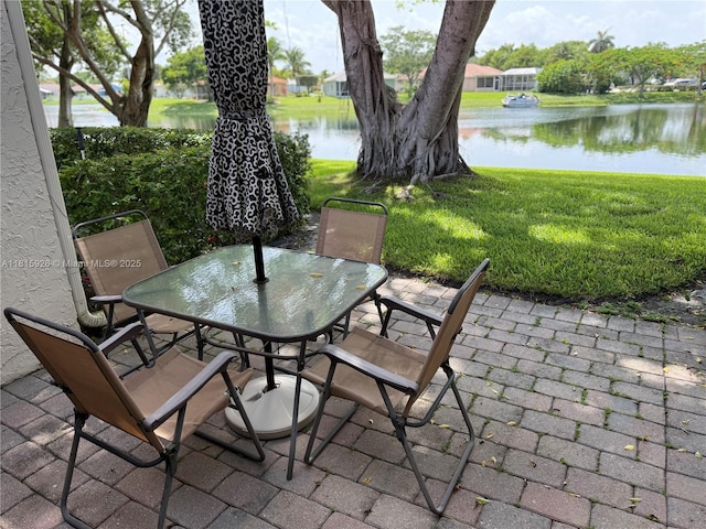 126 Centennial Ct, Deerfield Beach, FL 33442 - view of patio featuring outdoor dining space and a water view