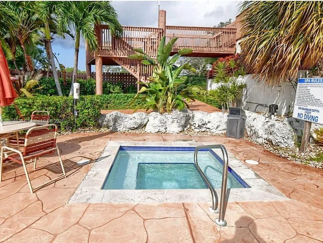 126 Centennial Ct, Deerfield Beach, FL 33442 - view of pool featuring a hot tub, a fenced backyard, and a patio
