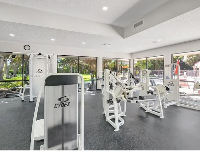 126 Centennial Ct, Deerfield Beach, FL 33442 - gym featuring a textured ceiling and recessed lighting