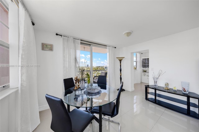 3161 S Ocean Dr Unit 1510, Hallandale Beach, FL 33009 - dining room featuring light tile patterned flooring and baseboards